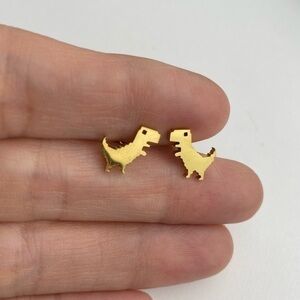 Gold tone stainless steel T Rex dinosaur stud earrings